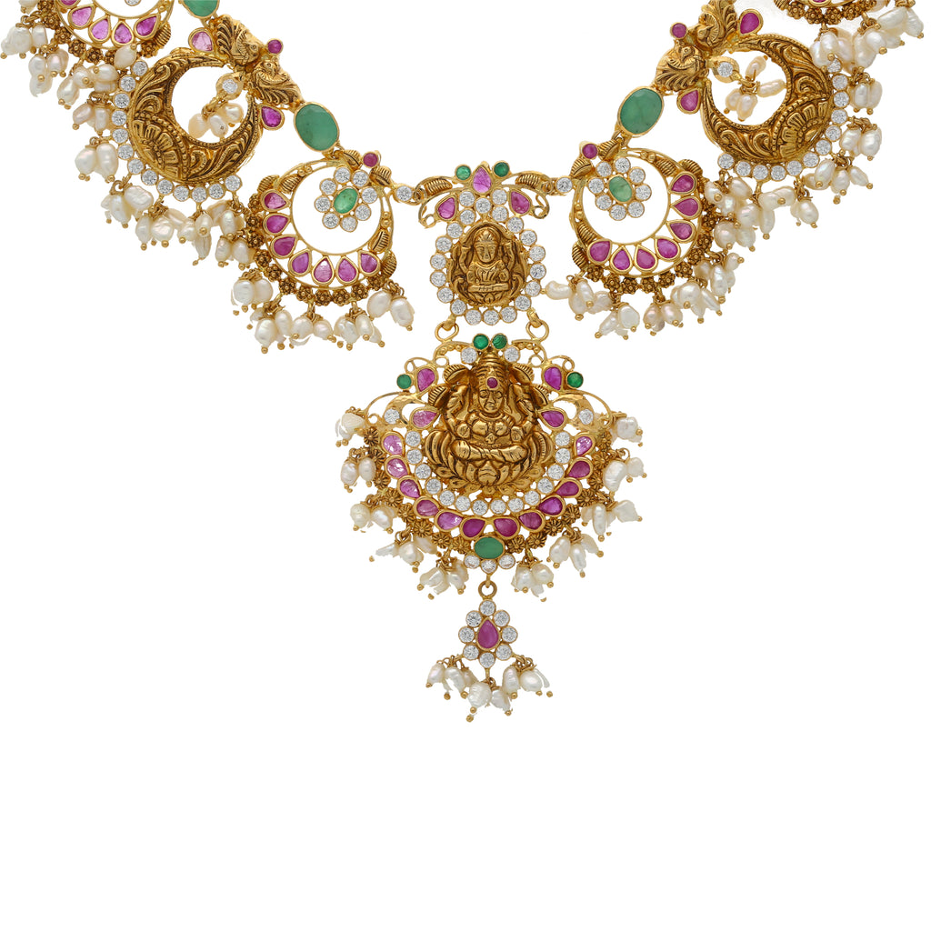 22K Gold & Gemstone Guddusapulu Necklace Set (61.9gm) | This amazing 22k yellow gold necklace set comes with gorgeous Indian gold necklaces adorned with ...