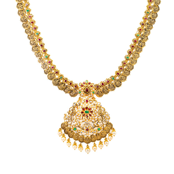 22K Yellow Gold Kasu Necklace and Earring Set (145.6 grams) | 
Adorn yourself with cultural elegance when you wear this fabulous 22k gold jewelry set from Vira...