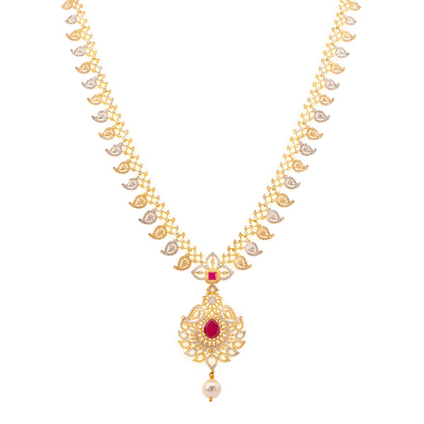 22K Gold, Ruby, & Pearls Veena Jewelry Set (101.8gm) | 
Our 22K Gold, Ruby, and Pearl Veena Jewelry Set has all the frills and thrills a woman needs to ...