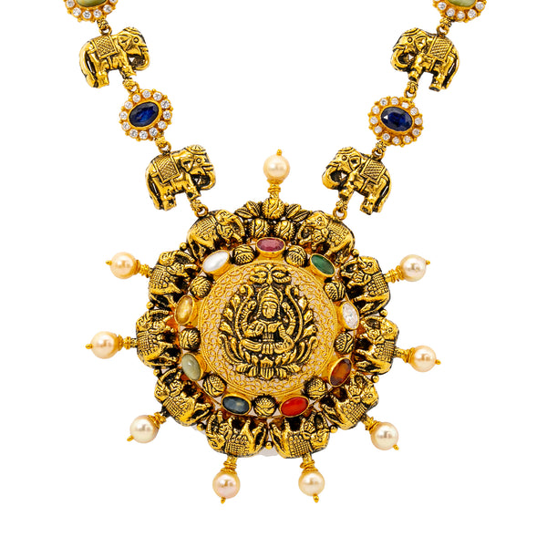 22K Yellow Gold Navratan Laxmi Necklace (86.6 grams) | 
This one-of-a-kind 22k antique yellow gold navratan necklace for women has a glimmering assortme...