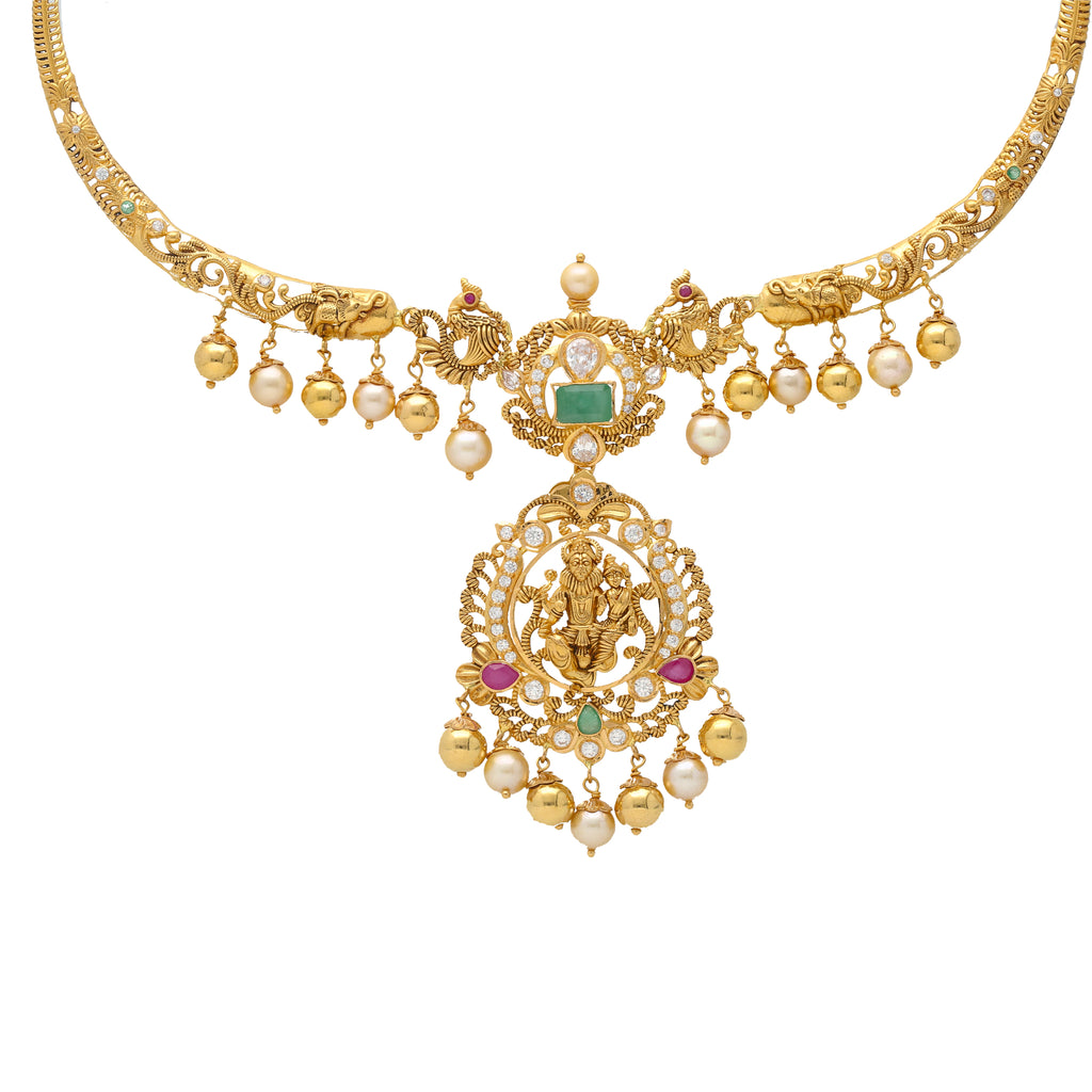 22K Yellow Gold & Gemstone Kanti Temple Necklace (44.1gm) | 
Our 22K Yellow Gold and Gemstone Kanti Temple Necklace has a unique design accentuated by gorgeo...