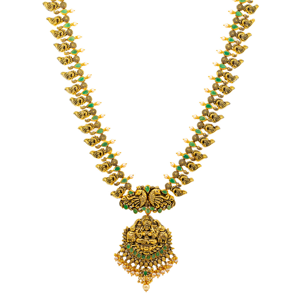 22K Antique Gold, Emerald, & Pearl Goddess Laxmi Necklace (90.3 grams) | 
The 22k antique gold Goddess Laxmi necklace has an array of shimmering green emeralds & pear...