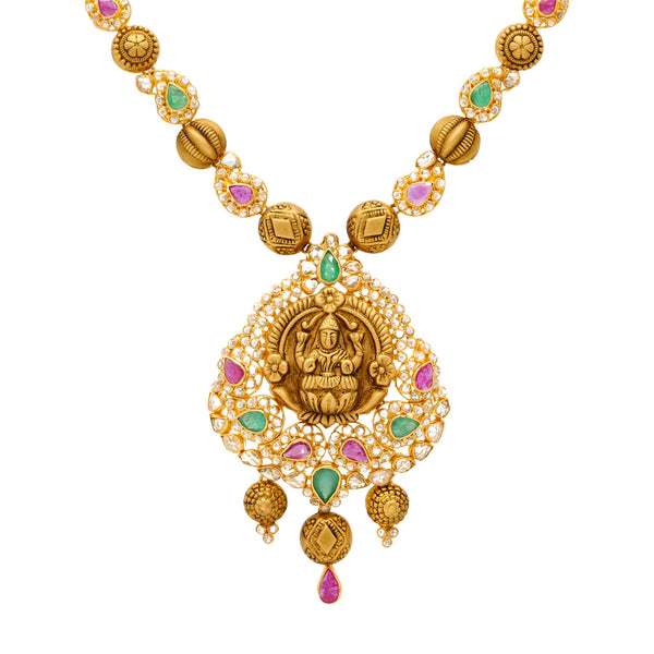 22K Yellow Gold Laxmi Jewelry Set with Gems & Uncut Diamonds | 
Our 22K Yellow Gold Laxmi Jewelry Set has an elaborately engraved design adorned with the most v...