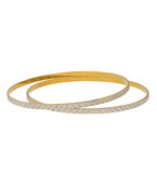 22K Yellow & White Gold Bangle Set of 10 (109.4gm) | 
Add this pair of gold Indian bangles use a lavish design made from 22k yellow and white gold to ...