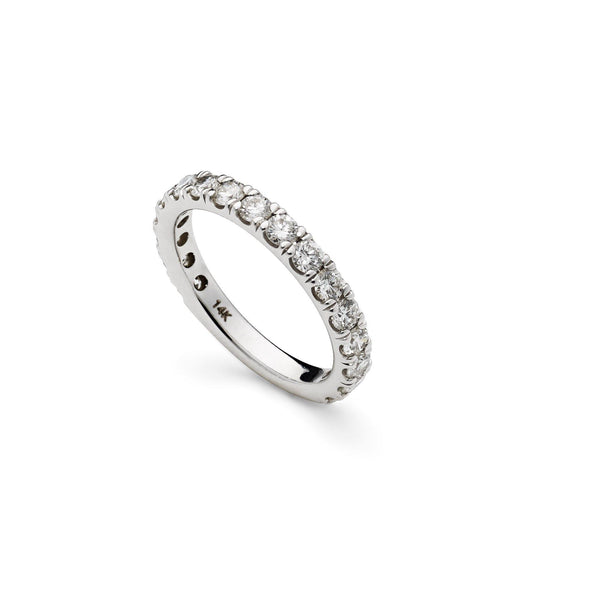 An image of a Virani Jewelers 14K white gold wedding ring standing up on its side. | Surprise your love with a beautiful white gold diamond wedding ring from Virani Jewelers.

Diamon...