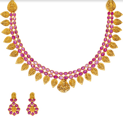An image of the 22K gold necklace set with ruby embellishments from Virani Jewelers.