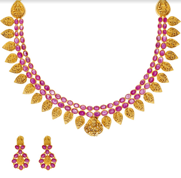 An image of the 22K gold necklace set with ruby embellishments from Virani Jewelers. | Celebrate your culture in style with a beautiful 22K gold necklace set from Virani Jewelers!

Des...
