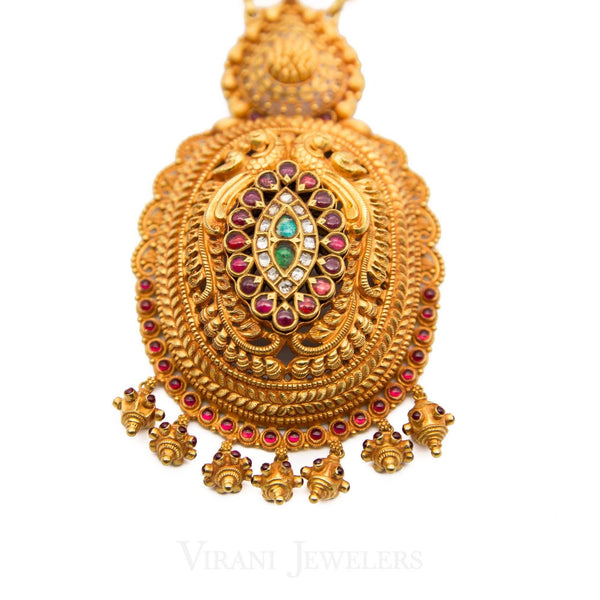 22K Antique Gold Finish Drop Necklace W/Kundans, Ruby, & Emerald Stones - Virani Jewelers | This is a 22K antique gold-finish ruby, Kundan, and emerald stones necklace with an Indian design...