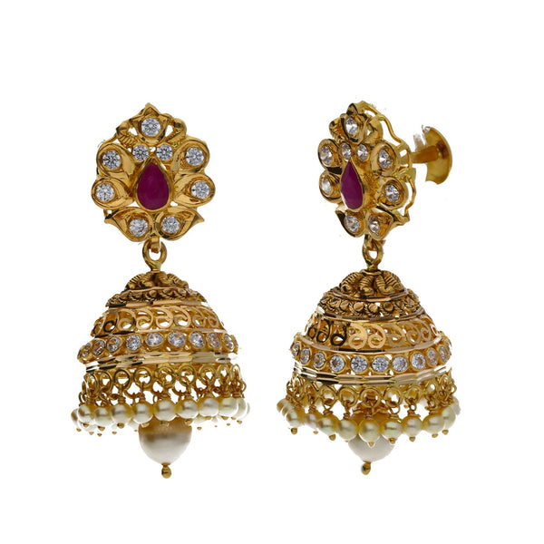 A close-up image of a pair of earrings in an Indian jewelry set from Virani Jewelers | Looking to add luxurious and versatile jewelry to your wardrobe? This 22K yellow antique gold set...