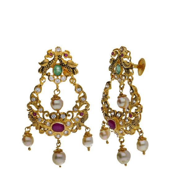 A close-up image of the side of two beautiful 22K yellow gold Indian earrings from Virani Jewelers | Introduce golden elegance to your wardrobe with this 22K yellow gold jewelry set from Virani Jewe...