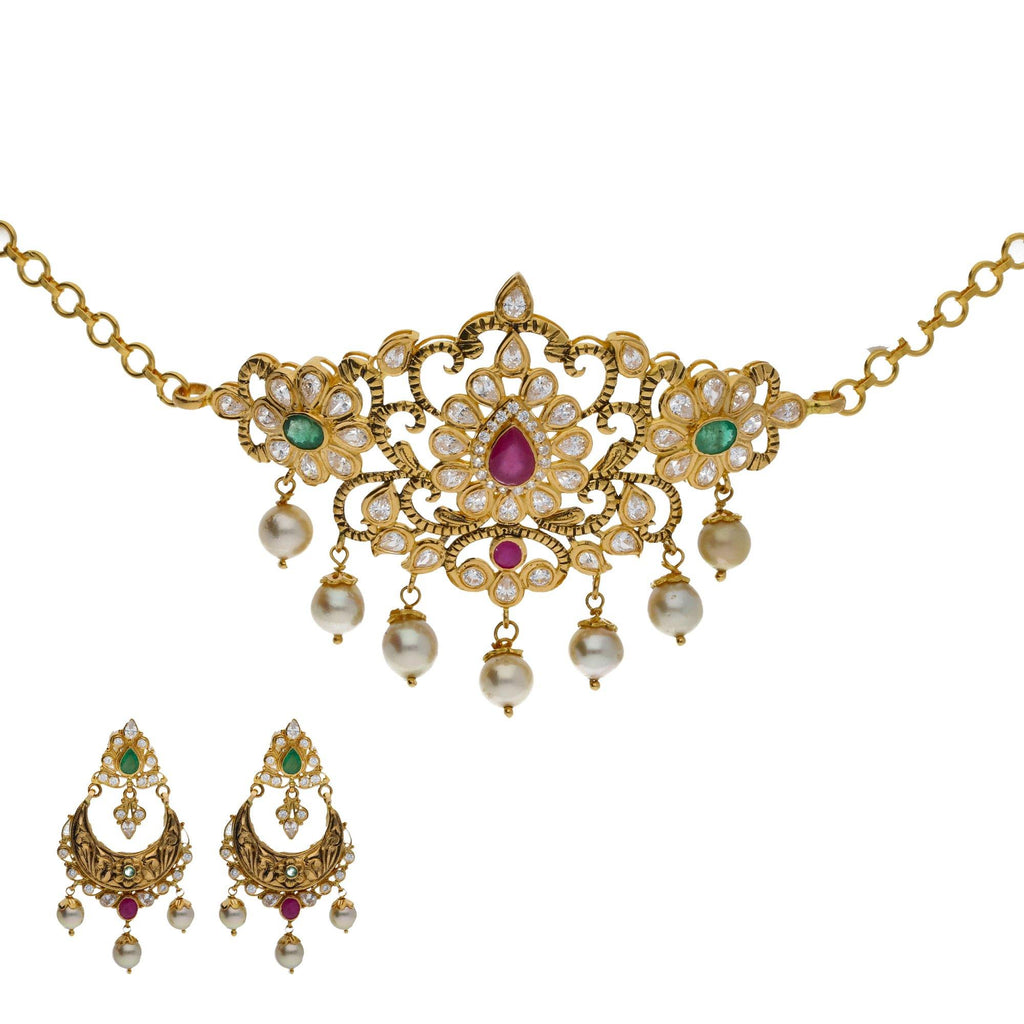 An image of an elegant Indian jewelry set with a necklace and earrings from Virani Jewelers | Searching for elegant 22K yellow gold jewelry to complement your formal attire? Check out this Va...