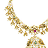 A close-up image of one side of a detailed gold Indian necklace from Virani Jewelers | Add luster to your wardrobe with this gorgeous 22K yellow antique gold jewelry set from Virani Je...