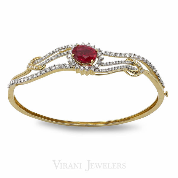 1.43CT Diamond Bangle Set in 18K Yellow Gold W/ Oval Cut Ruby Stone - Virani Jewelers | This is our oval-cut ruby stone and 1.43ct diamond bangle set in 18K yellow gold. The bracelet si...