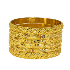 Set of six yellow 22K bangles from Virani Jewelers featuring intricate details.